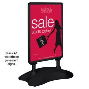 Black Pavement Sign with a water or sand filled base and robust wheels,