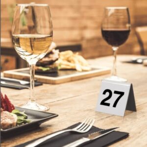 Ten Stackable acrylic table numbers for reserving restaurant tables.